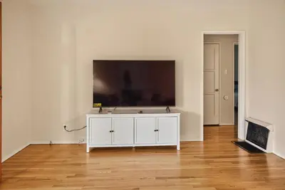 a white cabinet in a room with a tv on the wall at Luxury Cozy 2BR 1BA near LAX, LMU, SoFi Stadium, Beach in Los Angeles