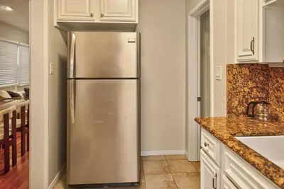 a stainless steel refrigerator in a kitchen at Stylish LAX Area 2BR 1BA by LMU, SoFi Stadium & Coastal Beaches in Los Angeles