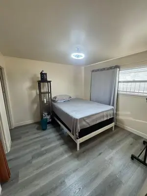 a bedroom with a bed in the corner of a room at Long Beach vocation home in Long Beach