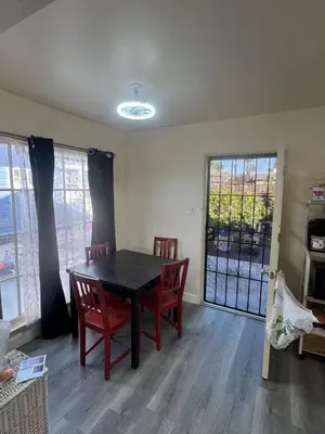 a dining room with a table and chairs and a window at Long Beach vocation home in Long Beach
