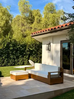 a patio with two white couches and a bench at The Chapel - Luxury Historic Ojai Villa in Ojai