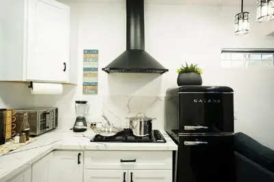 a kitchen with a stove with a pot on it at Modern Guesthouse ADU Sanctuary in San Bernardino