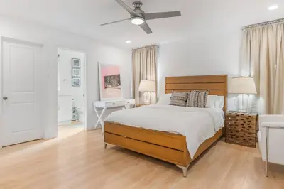 a bedroom with a bed and a ceiling fan at Minimalist Serene Home near Rose Bowl Stadium in Pasadena