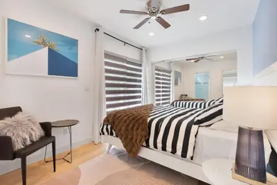 a bedroom with a bed and a window at Minimalist Serene Home near Rose Bowl Stadium in Pasadena