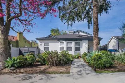 a white house with trees and plants at Minimalist Serene Home near Rose Bowl Stadium in Pasadena