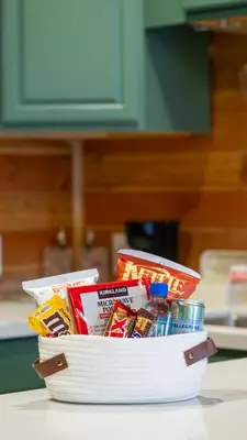 a white container filled with different types of food at Arkouda Stays in Big Bear Lake