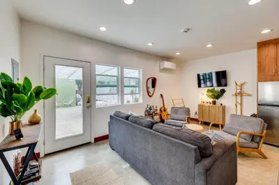 a living room with a couch and a table at 3 Mi to Old Pasadena Cozy Couples Studio with Pool in Pasadena