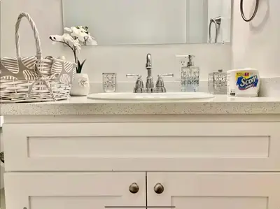 a bathroom counter with a sink and a mirror at Proper Stays at Melrose - West Hollywood Premium E suite in Los Angeles