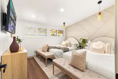 a bedroom with two beds and a couch at Exclusive Disney Resort- Private Pool & Luxe Stay in Anaheim