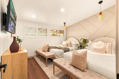 a bedroom with two beds and a couch at Exclusive Disney Resort- Private Pool & Luxe Stay in Anaheim