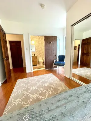 a living room with a large rug on the floor at Culver Adjacent Spanish in Los Angeles