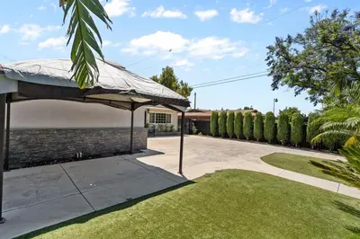 a patio with an umbrella in a yard at Wonderful Home Near Claremont! With Amazing Backyard! in Pomona