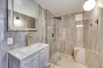 a bathroom with a sink and a shower at Hillside Home with Outdoor Oasis and Pool in Sherman Oaks