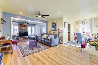 a living room with a couch and a tv at Stylish Home Near SoFi Stadium, LAX and Long Beach in Compton