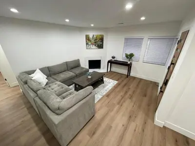 a living room with a couch and a table at 2 bedroom Cozy house in heart of Burbank in Burbank