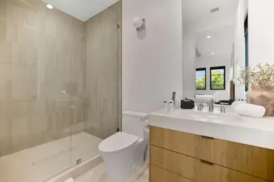 a bathroom with a toilet and a sink and a shower at Kraft Villa in Los Angeles