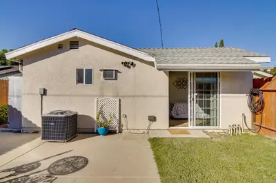 a small house with a yard with a fence at Work and Play! Extended-Stay Studio in Simi Valley in Simi Valley