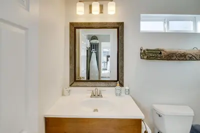 a bathroom with a sink and a mirror at Work and Play! Extended-Stay Studio in Simi Valley in Simi Valley