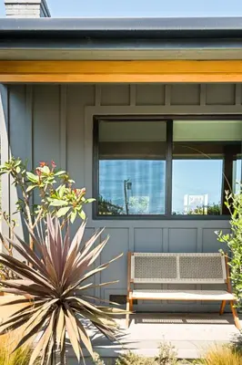 a bench on the front of a house at LA Oasis with Private Yard 10 min to Beach LAX 405 in Los Angeles