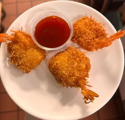 a plate of fried food with a dipping sauce at Bear Creek Resort in Big Bear Lake