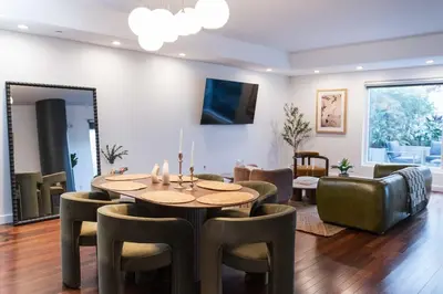 a dining room with a table and chairs at The W Hotel Residence With Roof Top Pool, Gym Plus 2 Free Valet Parking spaces in Los Angeles
