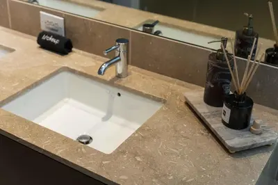 a white sink in a counter in a bathroom at The W Hotel Residence With Roof Top Pool, Gym Plus 2 Free Valet Parking spaces in Los Angeles