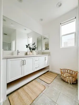 a white bathroom with a sink and a mirror at Central, Urban Townhouse with Private Roof Deck in Garden Grove