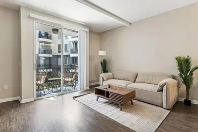 a living room with a couch and a table at Chic Marina Oasis 5 star Amenities Central in Los Angeles