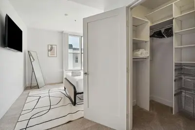 a room with a door leading to a bedroom at Modern Marina Sanctuary Central Pool Gym Spa in Los Angeles
