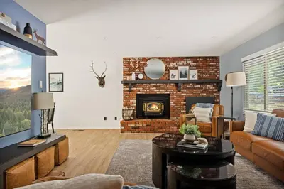a living room with a couch and a fireplace at Skiers Crest - Hot Tub, Yard, Near Lake & Slopes in Big Bear Lake