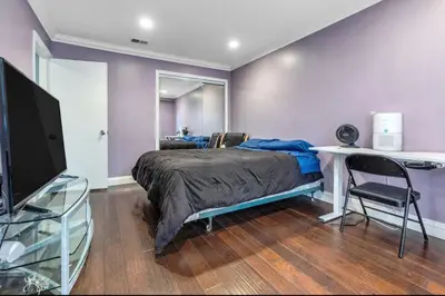 a bedroom with a bed and a desk and a tv at 2 Bed Apartment with Private Terrace Near SoFi in Los Angeles