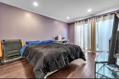 a bedroom with a large bed and a television at 2 Bed Apartment with Private Terrace Near SoFi in Los Angeles