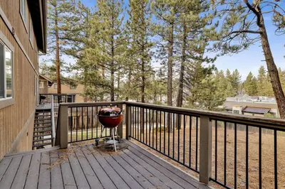 a wooden deck with a bowl on top of it at Brownie Resort Your Walk-to-Summit Getaway Family's Snowboarders Skiers in Big Bear Lake