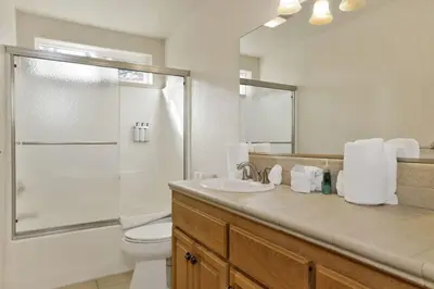 a bathroom with a toilet and a shower and a sink at Brownie Resort Retreat Walk-to-Ski Snow Summit Duplex Getaway in Big Bear Lake