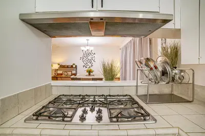 a kitchen with a stainless steel stove top oven at Home 1 Mi to UC Riverside Families Welcome! in Riverside