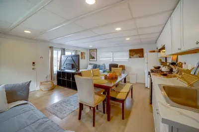 a kitchen and living room with a table and a couch at 5 Mi to Dtwn Riverside and Hospital! Remote-Work Hub in Riverside