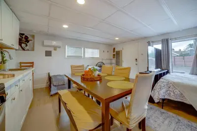 a kitchen and dining room with a table and a bed at 5 Mi to Dtwn Riverside and Hospital! Remote-Work Hub in Riverside