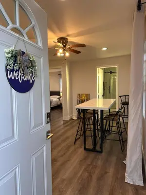a dining room with a table and a ceiling fan at Cozy Home near Beaches, LAX, SoFi, Intuit Dome,405 in Hawthorne