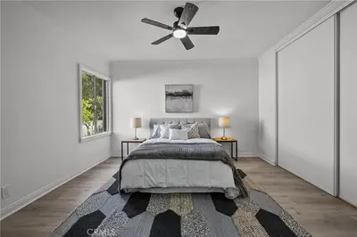 a bedroom with a bed and a ceiling fan at Fully Furnished 1-Bedroom in Los Angeles