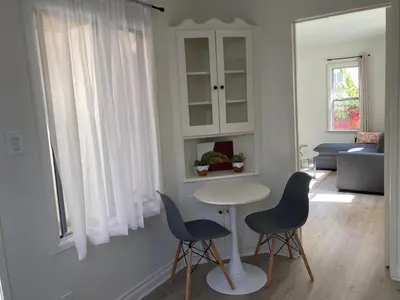 a living room with a table and two chairs at Fully Furnished 1-Bedroom in Los Angeles