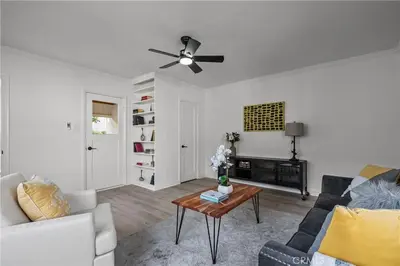 a living room with a couch and a ceiling fan at Fully Furnished 1-Bedroom in Los Angeles