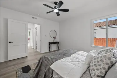 a bedroom with a ceiling fan and a bed at Fully Furnished 1-Bedroom in Los Angeles