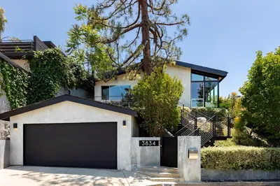 a house with a garage in front of it at Hillside Luxury MidCentury Modern Spa Retreat View in Los Angeles