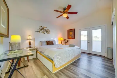 a bedroom with a bed and a ceiling fan at Family Home with Hot Tub! 2 Mi to Dtwn Riverside in Riverside