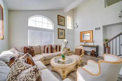 a living room with couches and a table at Family Home with Hot Tub! 2 Mi to Dtwn Riverside in Riverside
