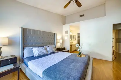 a bedroom with a large bed and a ceiling fan at Home 8 Mi to Dtwn Riverside Families Welcome! in Moreno Valley