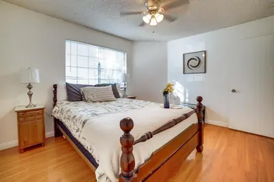 a bedroom with a large bed and a window at Home 8 Mi to Dtwn Riverside Families Welcome! in Moreno Valley