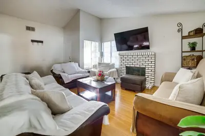 a living room with two couches and a fireplace at Home 8 Mi to Dtwn Riverside Families Welcome! in Moreno Valley