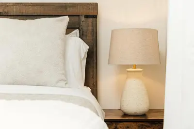 a bedroom with a bed and a lamp on a table at Beautiful 1BR with City Views in Los Angeles