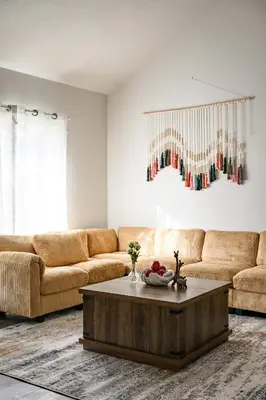 a living room with a couch and a coffee table at Stylish Retreat Large Living Space & Bright Suites in Norwalk